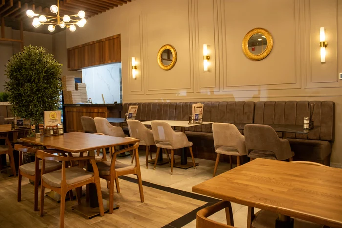 Banquette seating along the panelled wall
